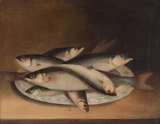 Poisson sur une assiette bleue et blanche